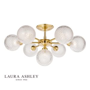 The Atherton 7 light semi flush ceiling light in satin brass finish with glass shades by Laura Ashley, shown on white background, with logo.