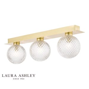 Prague 3 light bathroom mirror light in satin brass finish on white background.