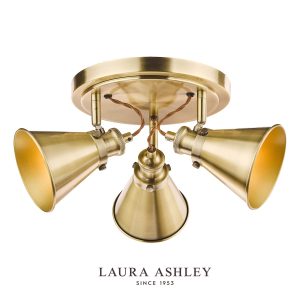 Laura Ashley Rufus 3 light spotlight plate in antique brass on white background, lit.