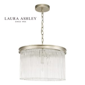 The Manon 3 light pendant in painted champagne finish with clear glass rods by Laura Ashley on white background.