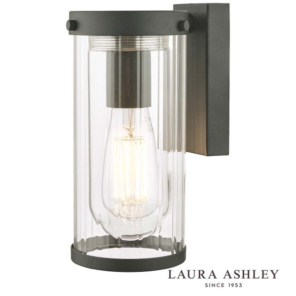 Arthur outdoor wall light in matt black finish with clear ribbed glass shade and rated IP44, on white background, with Laura Ashley Logo.
