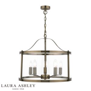 Harrington 5 light chain lantern in antique brass finish with clear glass by Laura Ashley, on white background, lit.