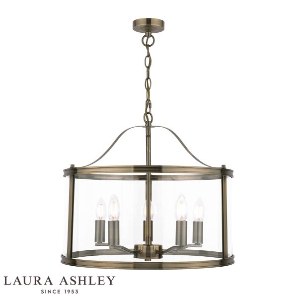 Harrington 5 light chain lantern in antique brass finish with clear glass by Laura Ashley, on white background, lit.