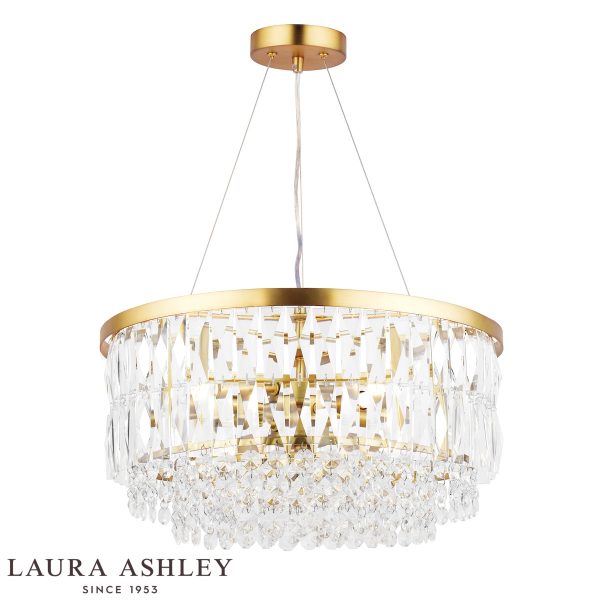 Laura Ashley Rhosill 4 light crystal pendant in matt antique brass, full height on white background, lit.