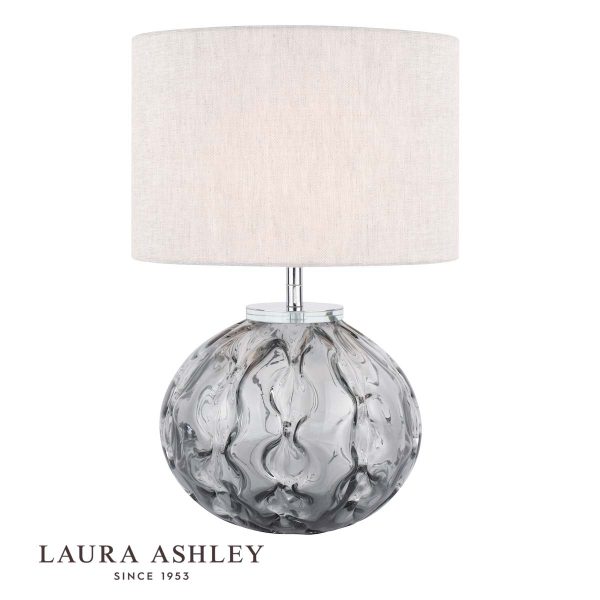 Laura Ashley Elderdale smoked glass table lamp with grey shade on white background, with logo.