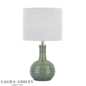 Laura Ashley Padley green ceramic table lamp with natural linen shade, on white background.