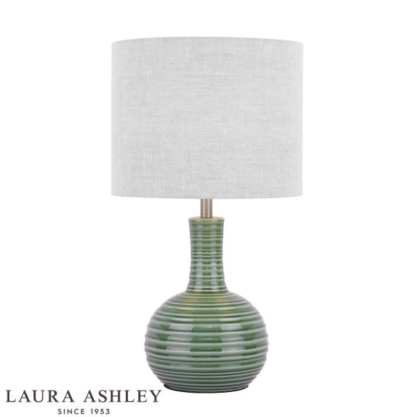 Laura Ashley Padley green ceramic table lamp with natural linen shade, on white background.