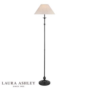 Laura Ashley Ludchurch candlestick floor lamp in industrial black, on white background, lit.