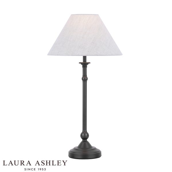 Laura Ashley Ludchurch candlestick table lamp in industrial black, on white background, lit.