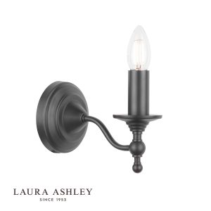 Laura Ashley Ludchurch single wall light in industrial black on white background, lit.