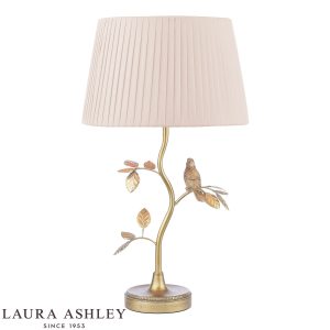 Egelton table lamp in aged brass finish with taupe shade by Laura Ashley, on white background, lit.