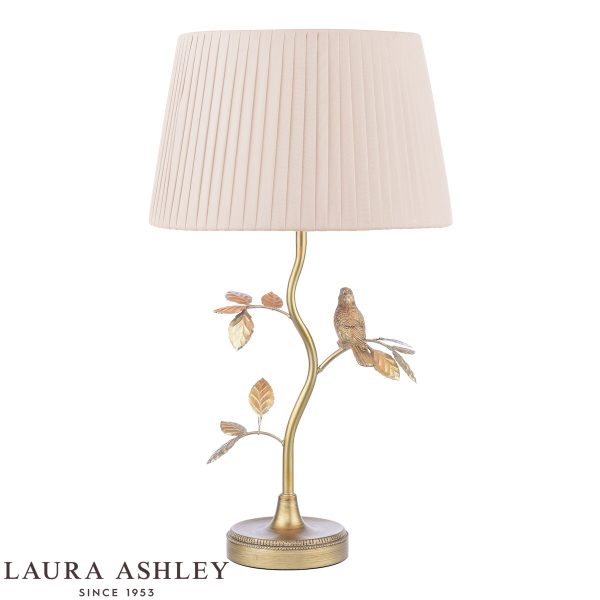 Egelton table lamp in aged brass finish with taupe shade by Laura Ashley, on white background, lit.