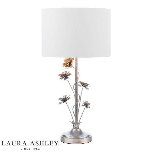 Lyndale distressed silver leaf table lamp with shade on white background, lit.