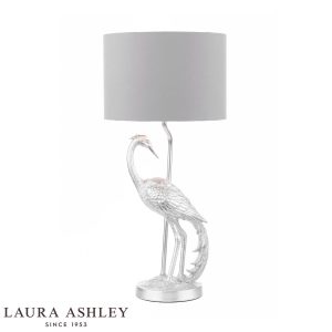 Tregaron heron table lamp in silver leaf with grey shade by Laura Ashley on white background.