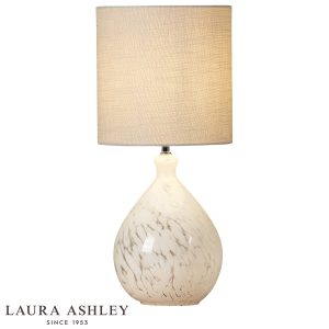 Laura Ashley Confetti table lamp in white art glass on white background, lit.