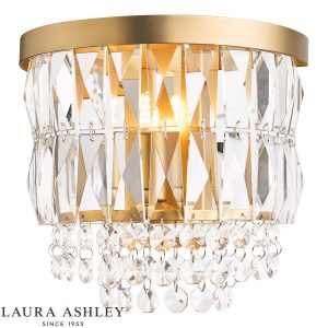 Laura Ashley Rhosill crystal wall light in matt antique brass finish on white background, lit.