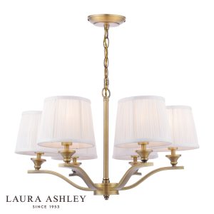 Laura Ashley Hemsley 6 light chandelier in matt antique brass on white background, lit.