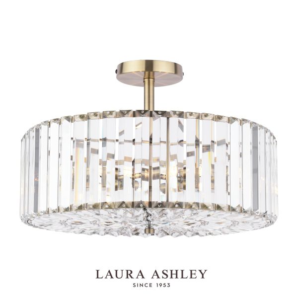 Laura Ashley Fernhurst 4 light crystal semi flush ceiling light in antique brass on white background.