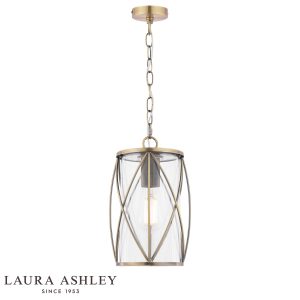 Beckworth single light pendant in antique brass finish with clear glass by Laura Ashley, full height on white background, lit.