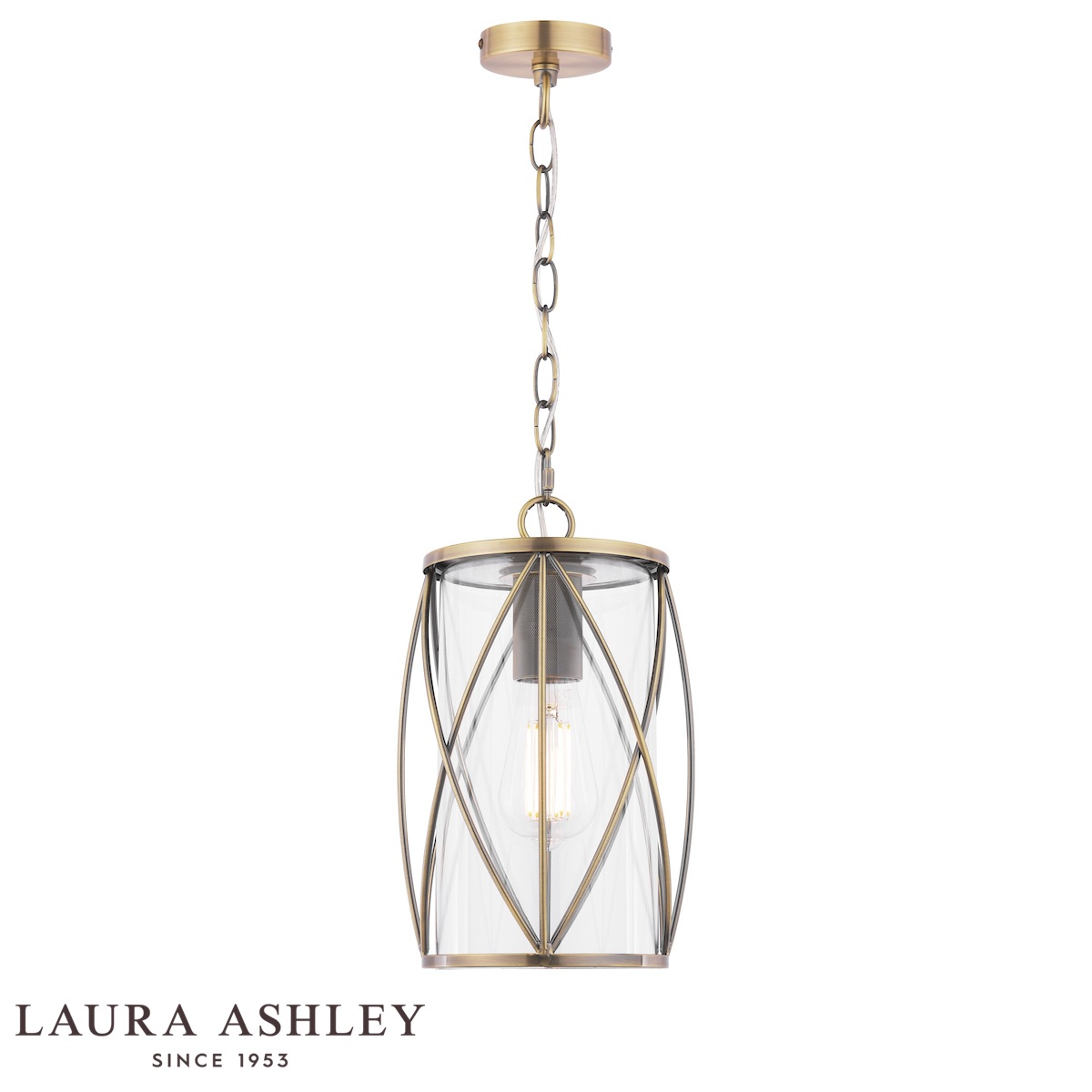 Beckworth single light pendant in antique brass finish with clear glass by Laura Ashley, full height on white background, lit.