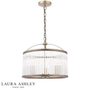 Sutton 3 light pendant in matt antique brass finish with clear glass rods by Laura Ashley, full height on white background, lit.