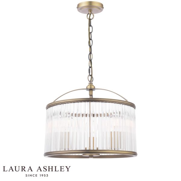 Sutton 3 light pendant in matt antique brass finish with clear glass rods by Laura Ashley, full height on white background, lit.