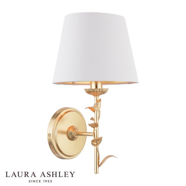 Laura Ashley Halton wall light in distressed gold leaf with cream shade, on white background.