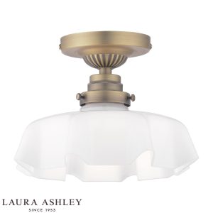 Banham 1 light semi flush ceiling light in matt antique brass finish with white glass shade, on white background, lit.