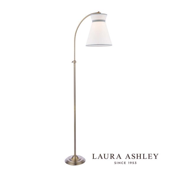Laura Ashley Dearham adjustable floor lamp in antique brass, on white background, with logo.