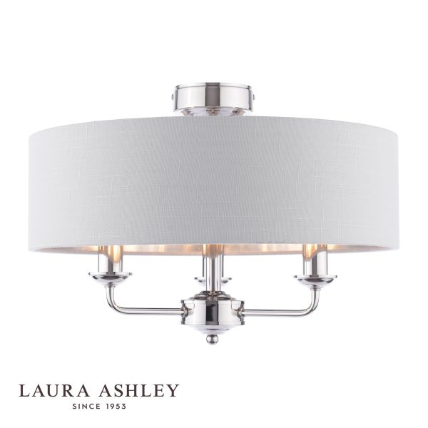 Sorrento 3 light semi flush in polished nickel with silver linen shade by Laura Ashley, on white background, lit.
