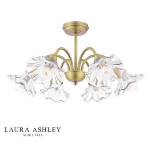 Kerswell 6 light semi flush ceiling light in matt antique brass finish with clear glass shades on white background, lit.