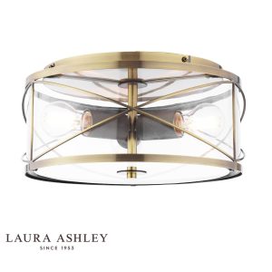 Beckworth 3 light flush in antique brass finish with clear glass by Laura Ashley, on white background, lit.