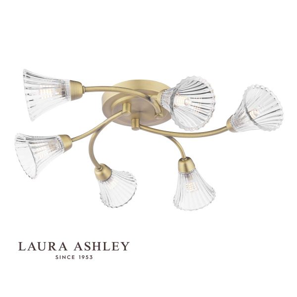 Lanton 6 light semi flush ceiling light in matt antique brass with ribbed glass shades by Laura Ashley, shown with logo on a white background.
