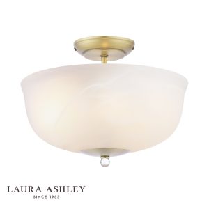 Cossington 2 light semi flush ceiling light in matt antique brass, on white background, lit.