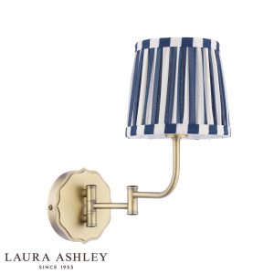 Denwick swing arm wall light in matt antique brass finish, on white background unlit.