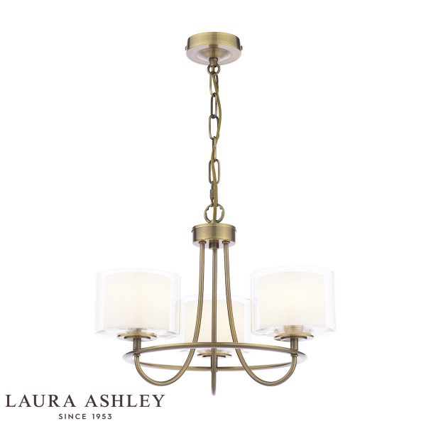 Southwell 3 light chandelier in antique brass finish with glass shades by Laura Ashley, full height on white background, lit.