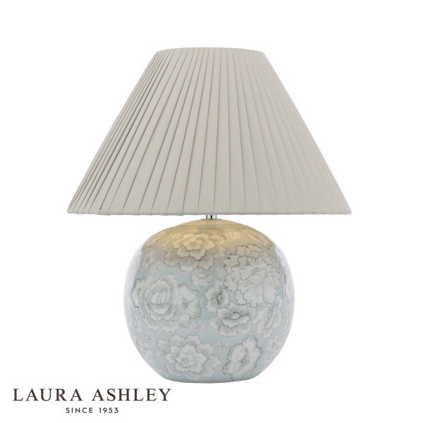 Laura Ashley Montford blue ceramic table lamp with taupe faux silk shade, on white background with logo.