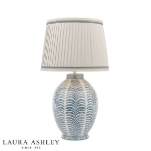 Laura Ashley Stannard blue ceramic table lamp with shade, on white background lit.