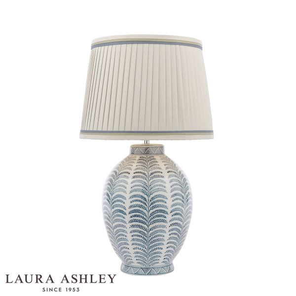 Laura Ashley Stannard blue ceramic table lamp with shade, on white background lit.
