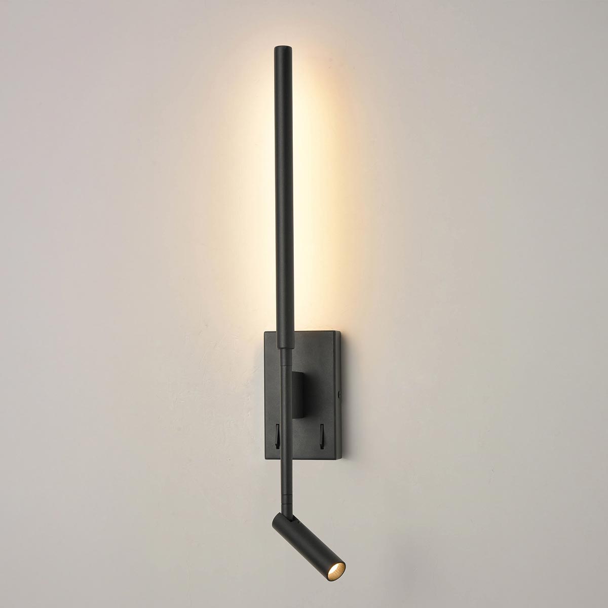 Franklite Luca contemporary switched LED bedside wall light with directional reading light in matt black, on grey background.