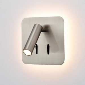 Franklite Luca switched LED square backlit bedside wall light with directional reading light in satin nickel, on grey background, lit.