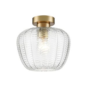 Franklite Mezcla flush aged brass ceiling light with clear chevron glass shade, on white background.