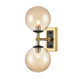 Franklite Stellar twin wall light in matt black and aged brass with smooth amber glass, vertical on white background.