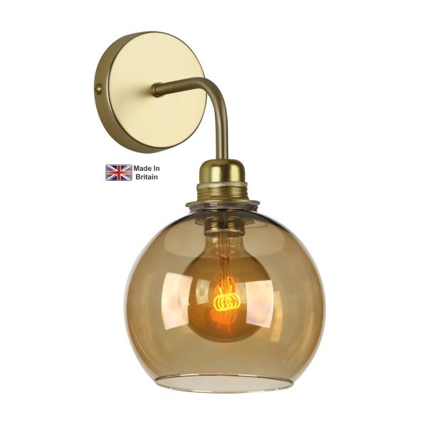 Apollo 1 light solid butter brass single wall light with amber glass shade on white background lit