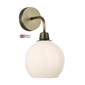 Apollo 1 light solid antique brass single wall light with opal glass shade on white background lit