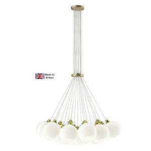 Apollo 19 light large cluster pendant in solid butter brass with opal glass shades on white background lit