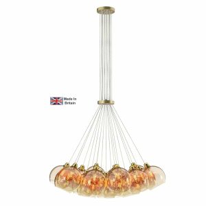 Apollo 19 light large cluster pendant in solid butter brass with amber glass shades on white background lit