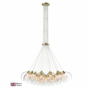 Apollo 19 light large cluster pendant in solid butter brass with clear glass shades on white background lit