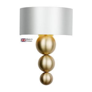 Athena wall washer light in solid butter brass shown with swan satin shade lit