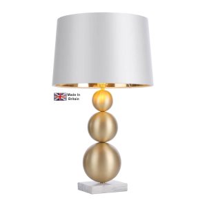 Athena table lamp in solid butter brass with white marble shown with swan satin shade lit